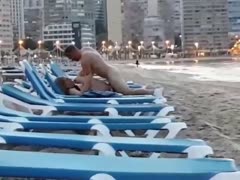 An amateur couple shamelessly had sex while lounging on the beach.